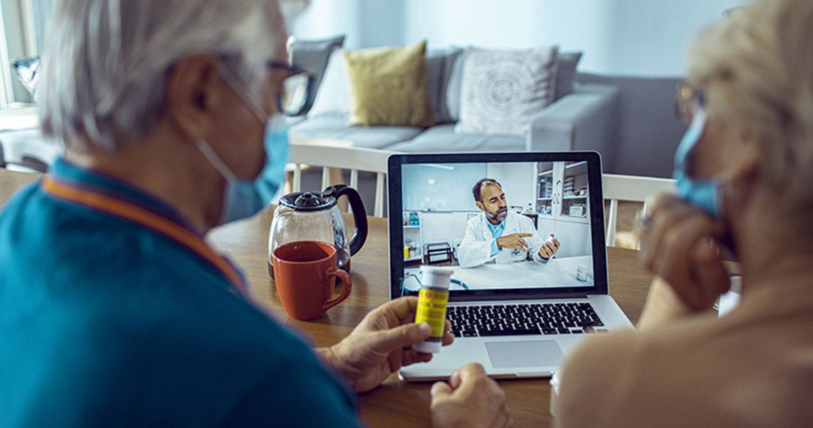 A couple has a TeleHealth visit with a physician