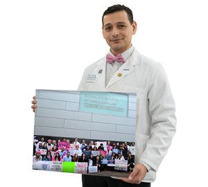 Student holding photo of activist group