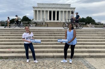 Students on the National Mall with Match Day signs