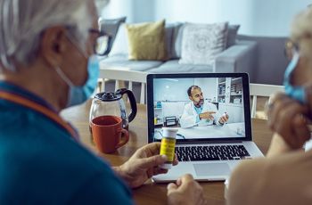 A couple has a TeleHealth visit with a physician