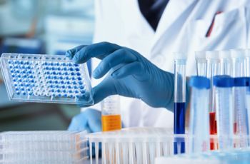 A Person in a Laboratory looking at some lab samples